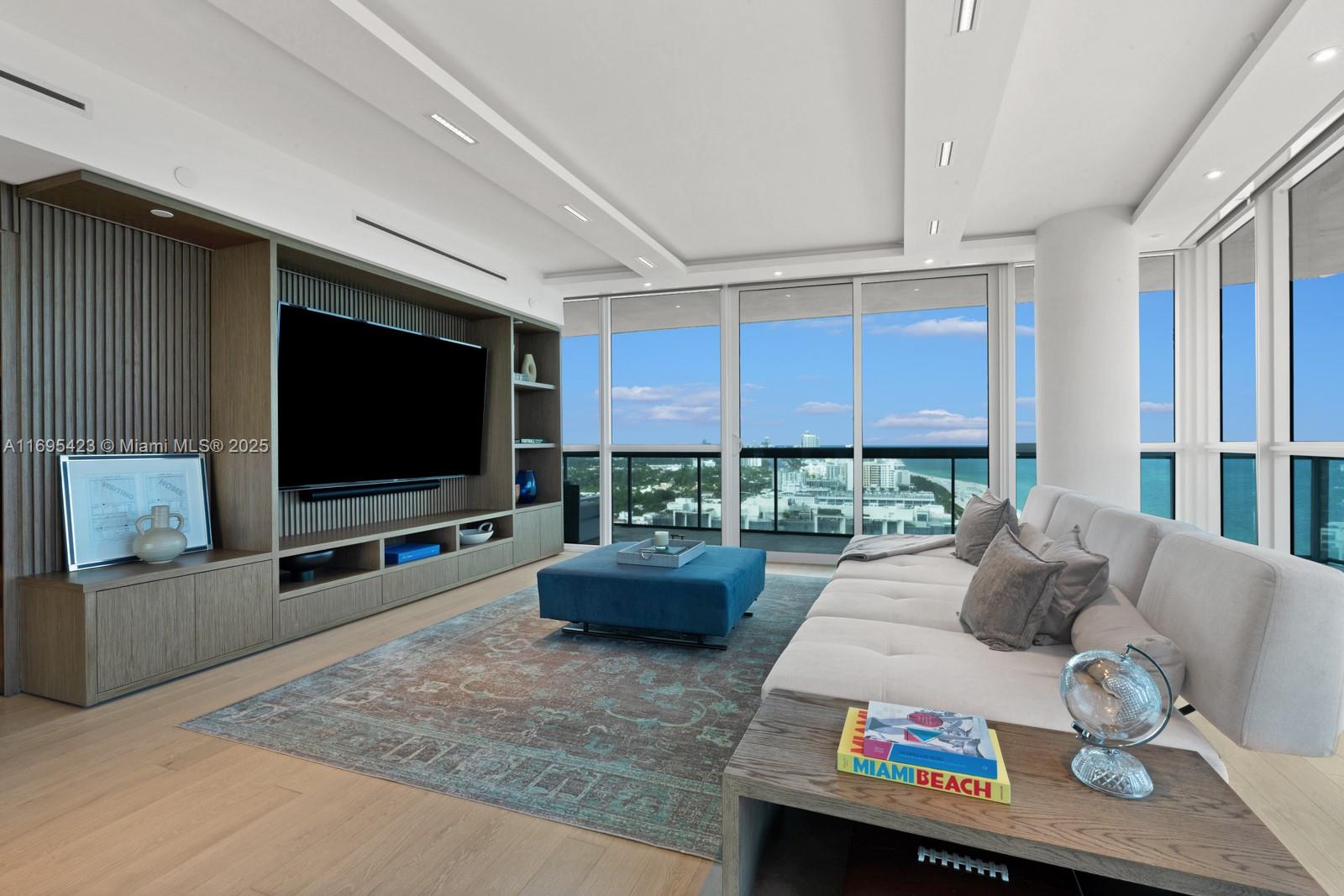 101 20th Street, Unit 3503/06/09 Miami Beach, FL 33139 - Photo 11 of 57 a living room with furniture and a flat screen tv