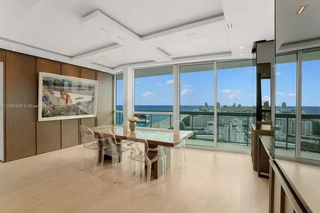 a room with lots of furniture and a large window