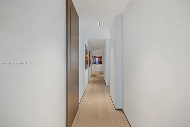 a view of a hallway with wooden walls