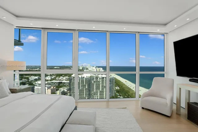 a view of a living room and a flat screen tv