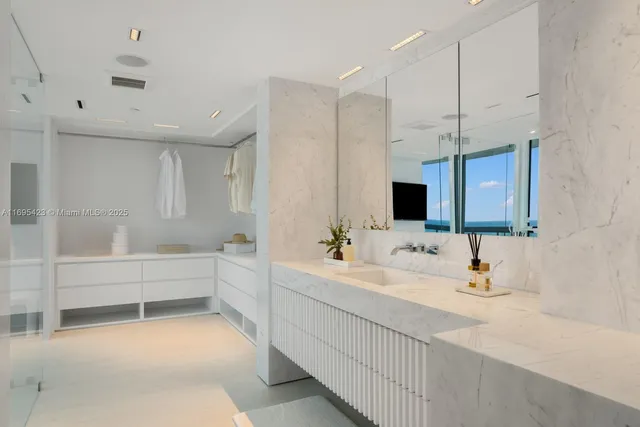 a bathroom with a double vanity sink mirror and bathtub