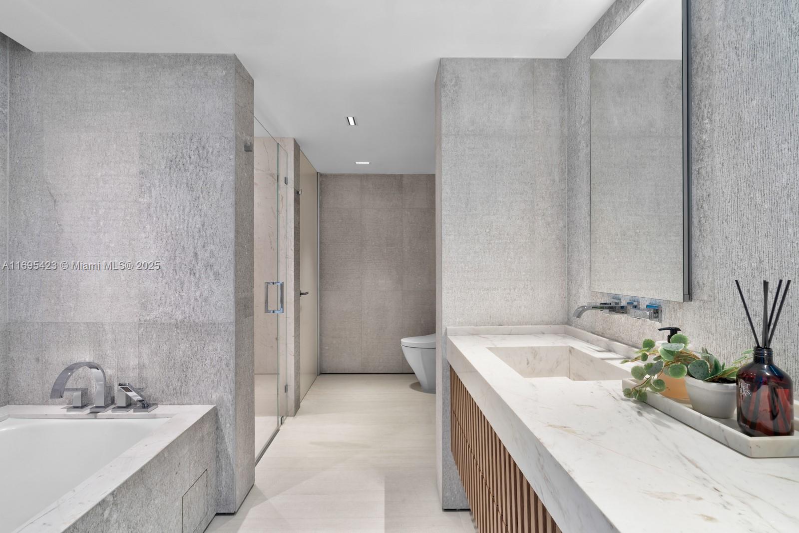 101 20th Street, Unit 3503/06/09 Miami Beach, FL 33139 - Photo 25 of 57 a bathroom with a tub sink and mirror