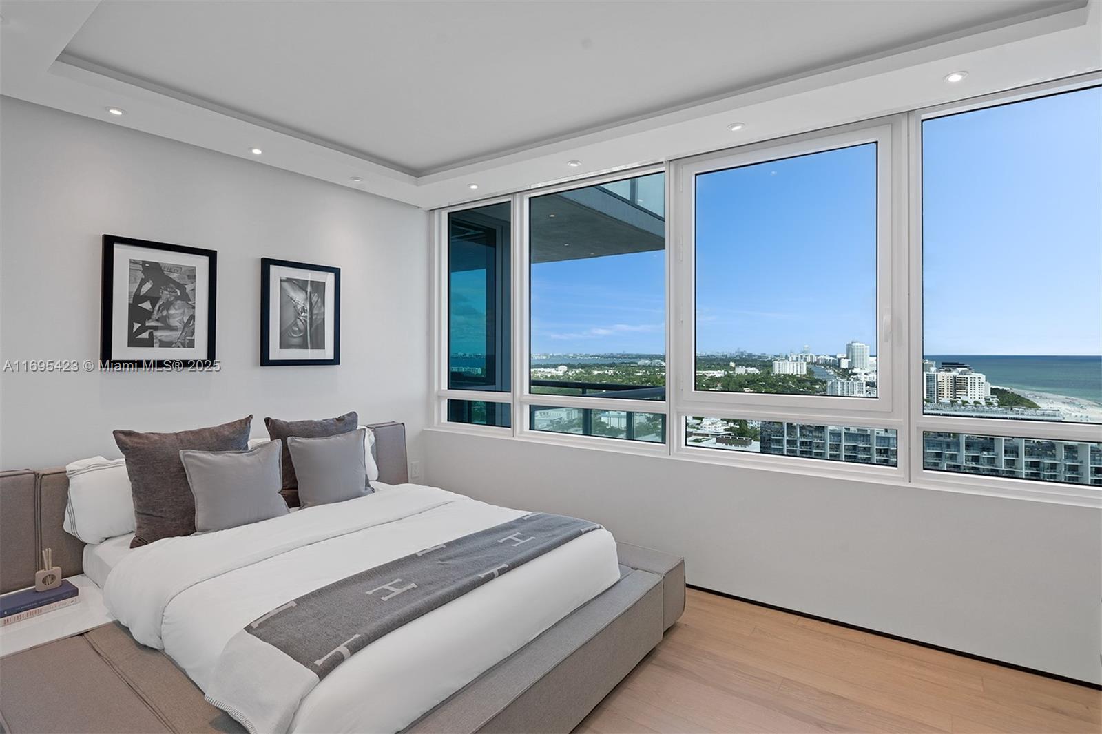 101 20th Street, Unit 3503/06/09 Miami Beach, FL 33139 - Photo 30 of 57 a bedroom with a large bed and a large window