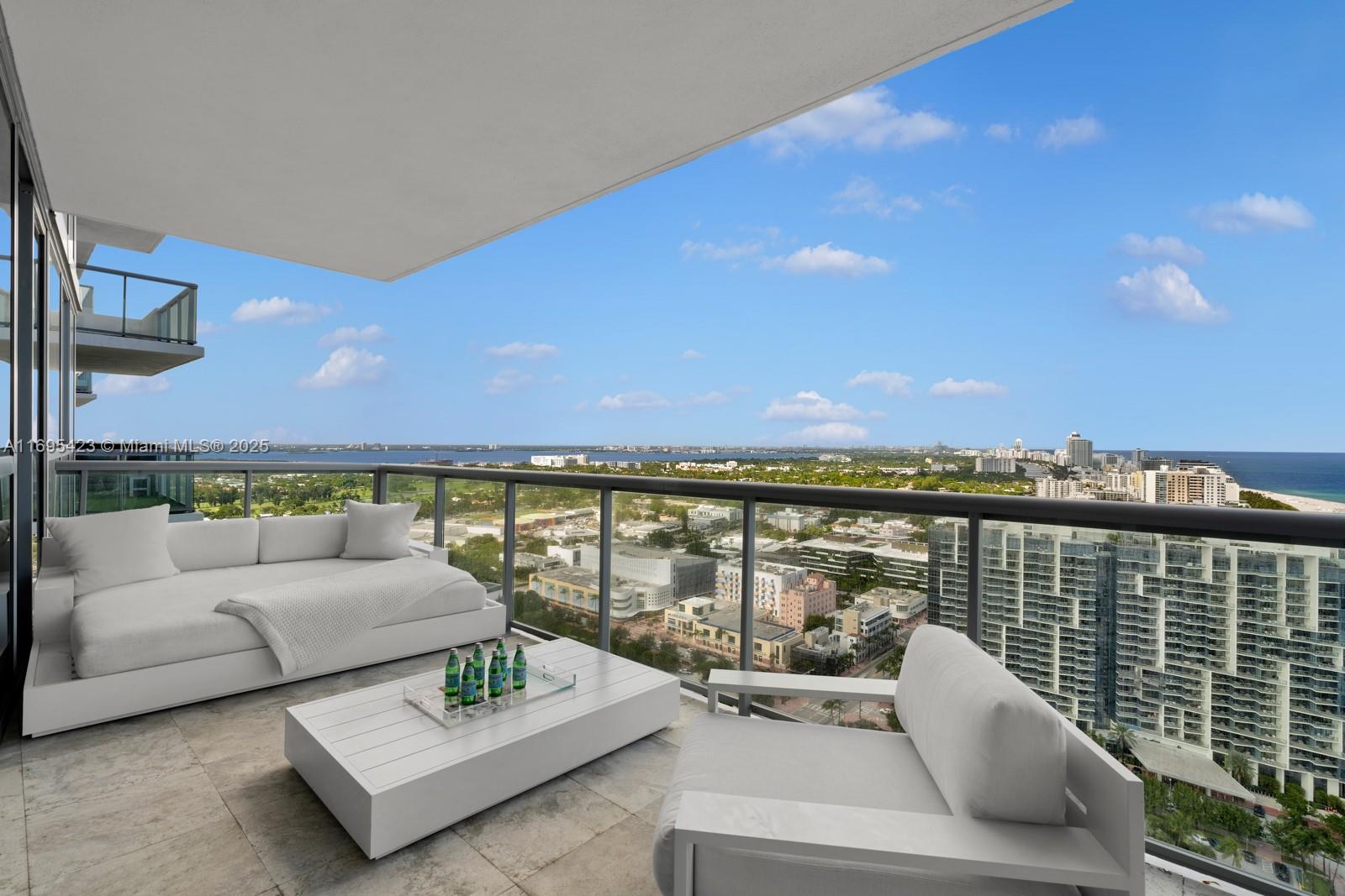 101 20th Street, Unit 3503/06/09 Miami Beach, FL 33139 - Photo 34 of 57 a view of a roof deck with couches and potted plants
