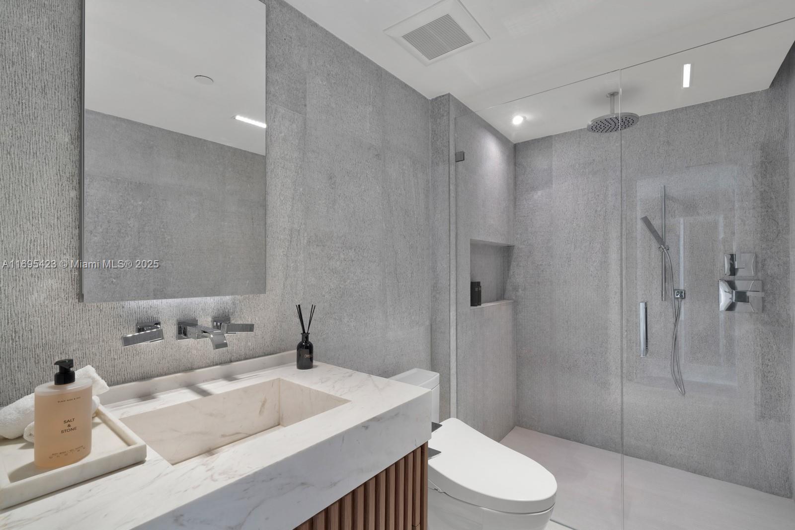 101 20th Street, Unit 3503/06/09 Miami Beach, FL 33139 - Photo 35 of 57 a bathroom with a sink a toilet and shower