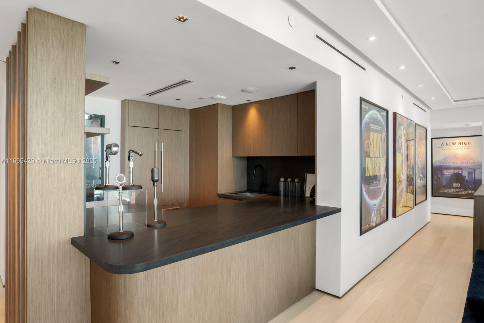 101 20th Street, Unit 3503/06/09 Miami Beach, FL 33139 - Photo 37 of 57 a kitchen with stainless steel appliances granite countertop a sink and a refrigerator