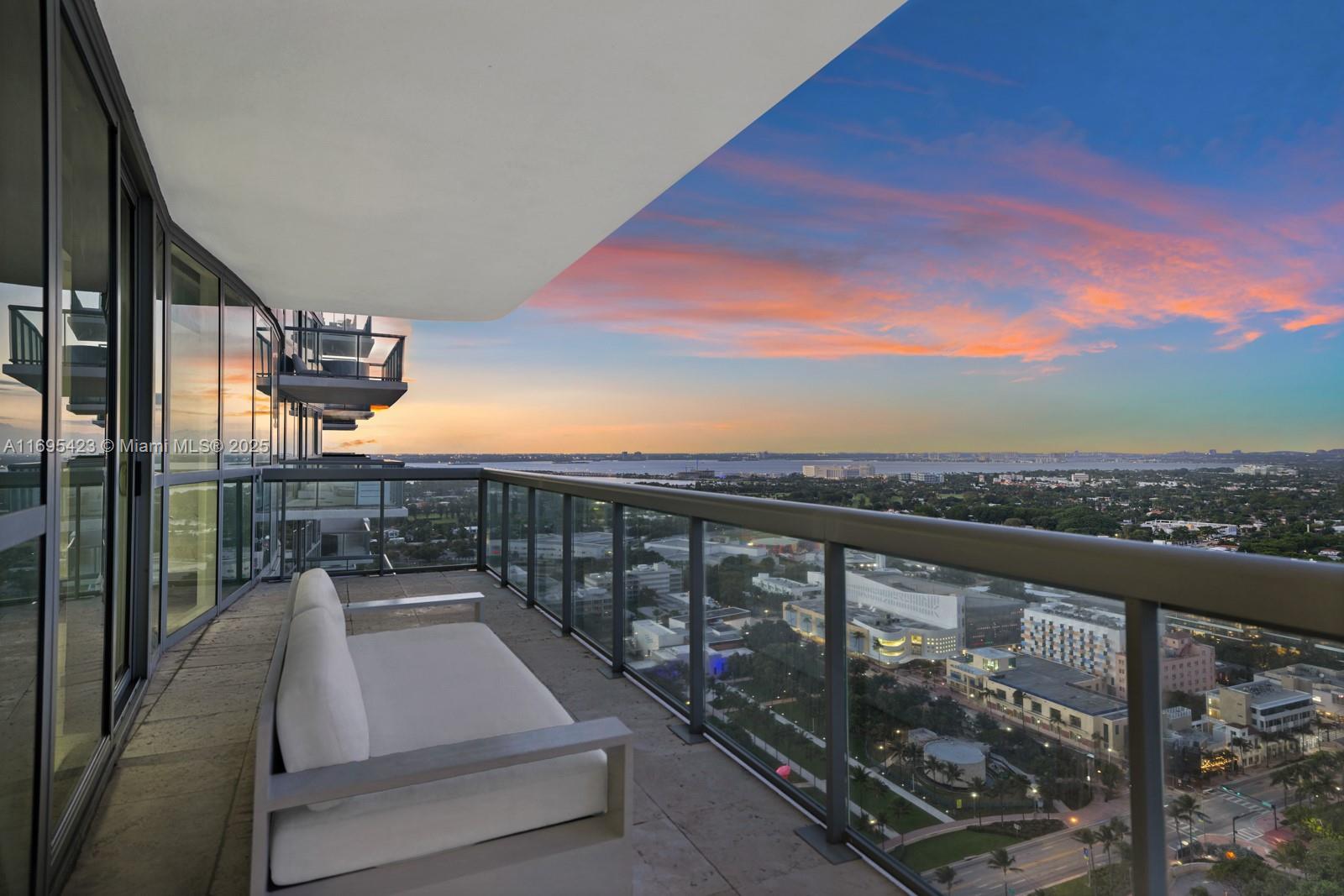 101 20th Street, Unit 3503/06/09 Miami Beach, FL 33139 - Photo 53 of 57 a view of roof deck with two chairs and wooden floor