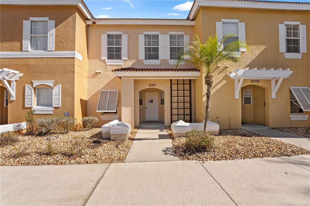 1017 Park Ridge Circle Kissimmee, FL 34746 - Photo 1 of 52 a front view of a house with a yard