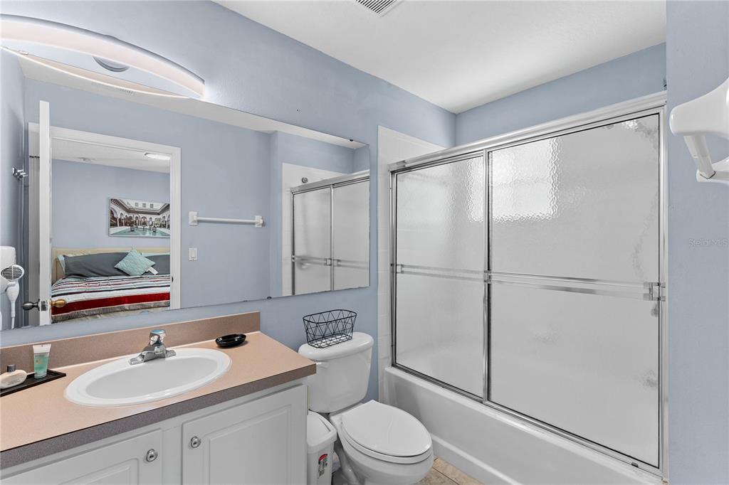 1017 Park Ridge Circle Kissimmee, FL 34746 - Photo 17 of 52 a bathroom with a sink toilet and shower
