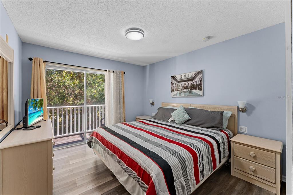 1017 Park Ridge Circle Kissimmee, FL 34746 - Photo 20 of 52 a bedroom with a bed and a large window