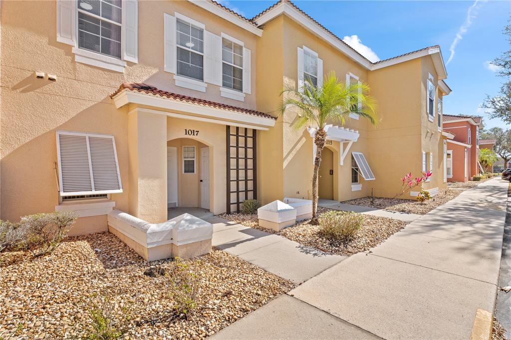 1017 Park Ridge Circle Kissimmee, FL 34746 - Photo 2 of 52 a front view of a house with a yard