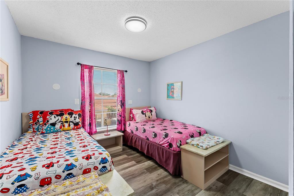 1017 Park Ridge Circle Kissimmee, FL 34746 - Photo 23 of 52 a bedroom with two beds and a table
