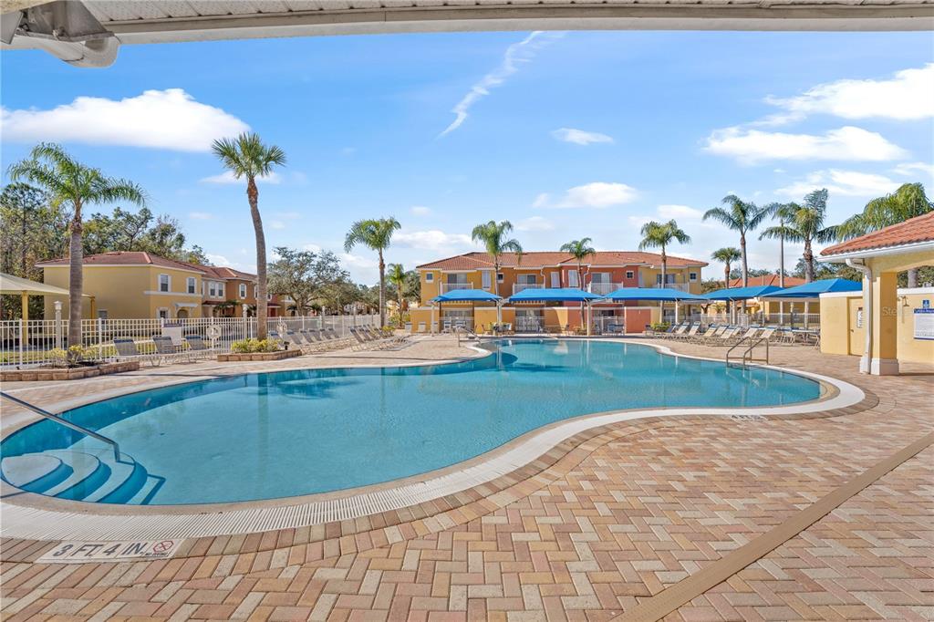 1017 Park Ridge Circle Kissimmee, FL 34746 - Photo 39 of 52 a view of a swimming pool with a yard