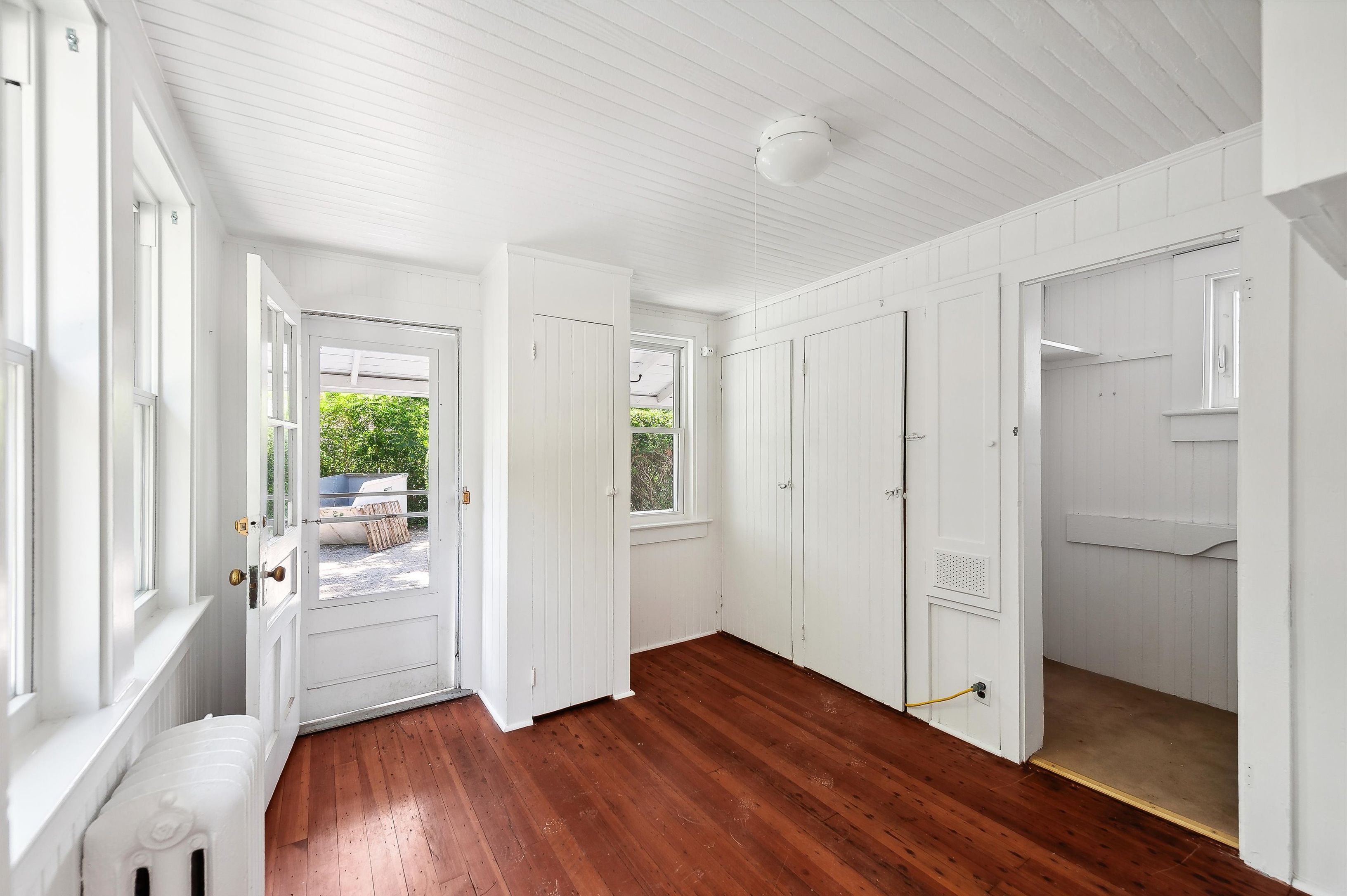 10 Pantigo Road East Hampton, NY 11937 - Photo 17 of 28 a big room with wooden floor and windows
