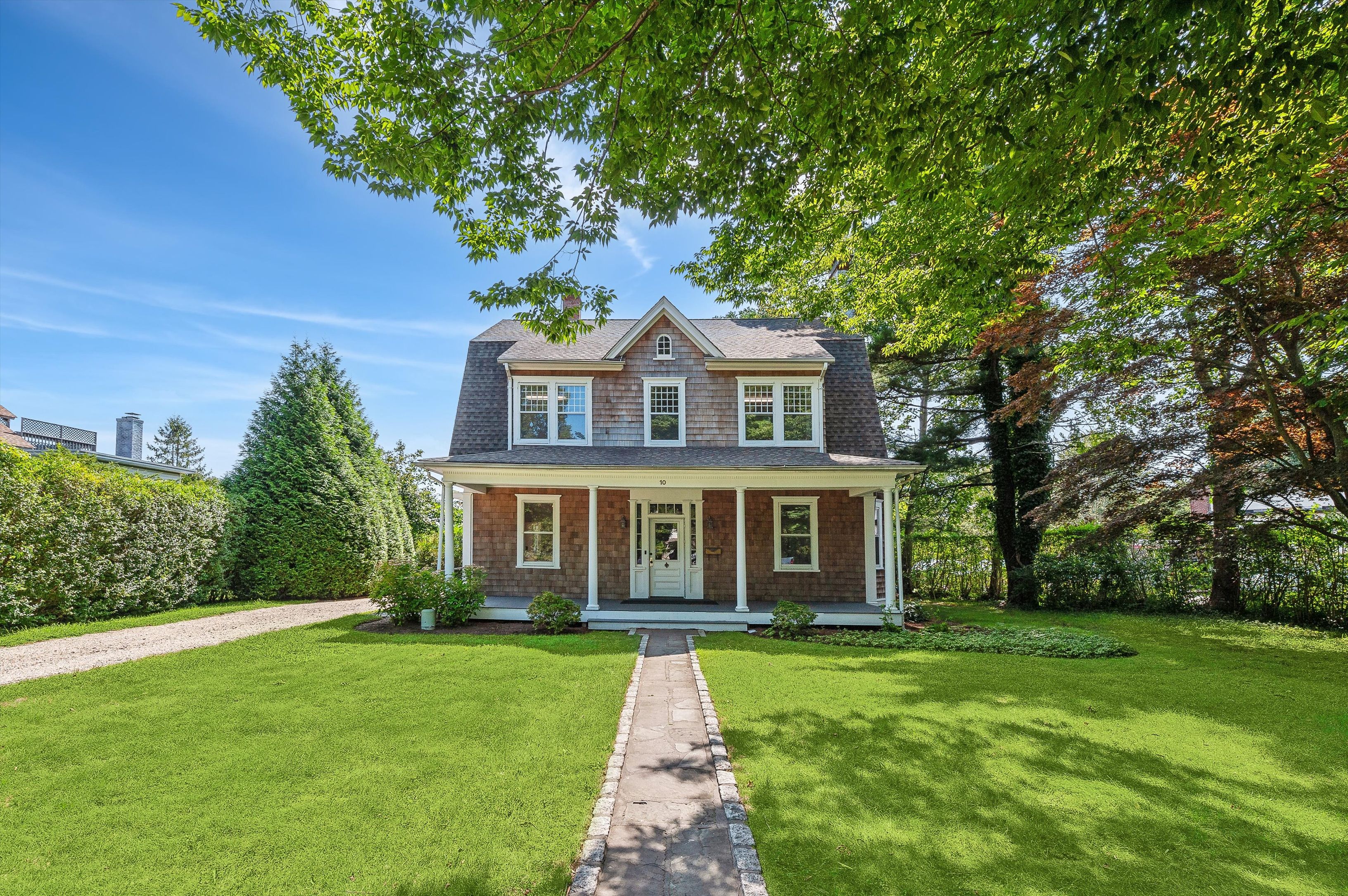 10 Pantigo Road East Hampton, NY 11937 - Photo 2 of 28 front view of a house with a yard