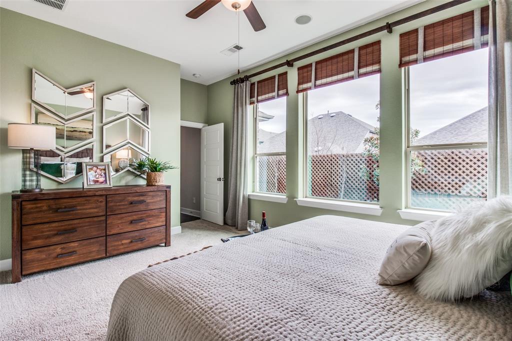 1605 Cedar Crest Drive Forney, TX 75126 - Photo 11 of 26 a bedroom with a bed and a dresser next to a window