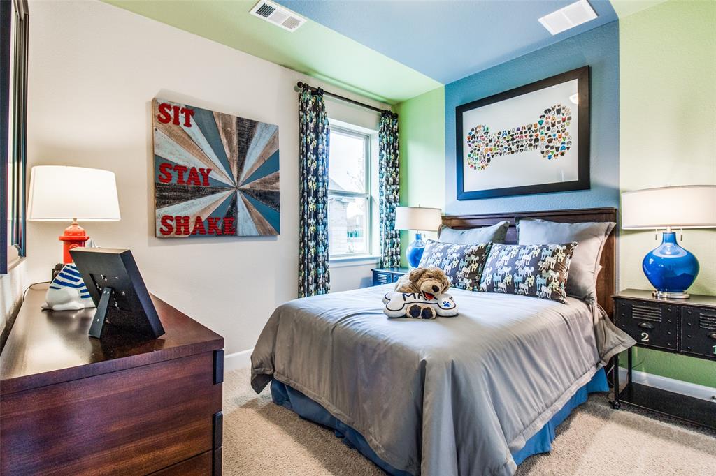 1605 Cedar Crest Drive Forney, TX 75126 - Photo 16 of 26 a bedroom with bed and a painting on the wall