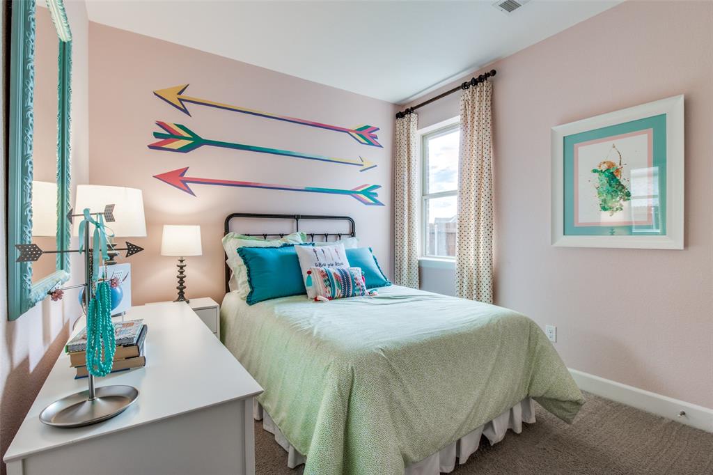 1605 Cedar Crest Drive Forney, TX 75126 - Photo 17 of 26 a bedroom with a bed and a window