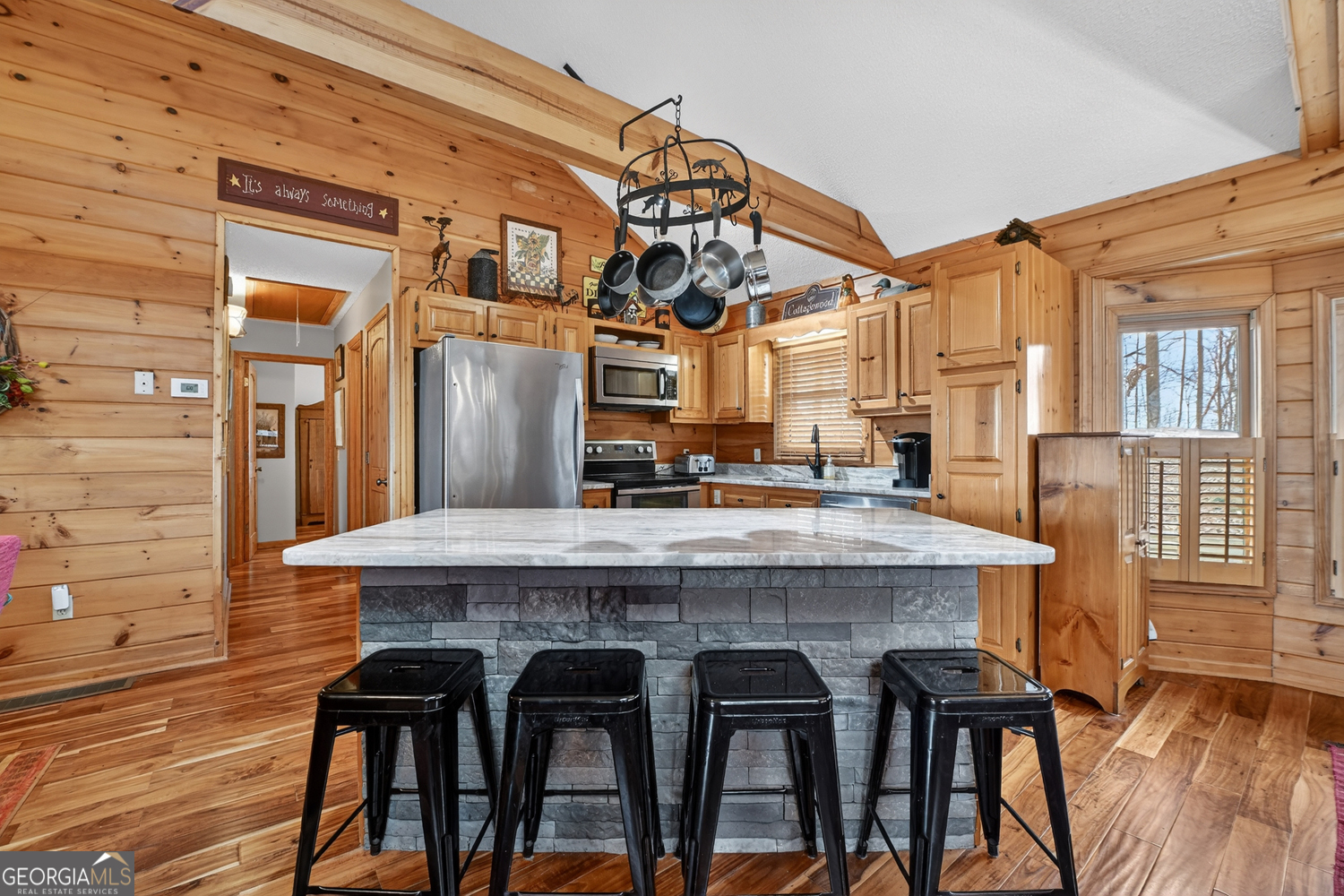 1189 Walnut Ridge, Unit 4044 Ellijay, GA 30536 - Photo 12 of 52 a view of a chairs and table in a patio