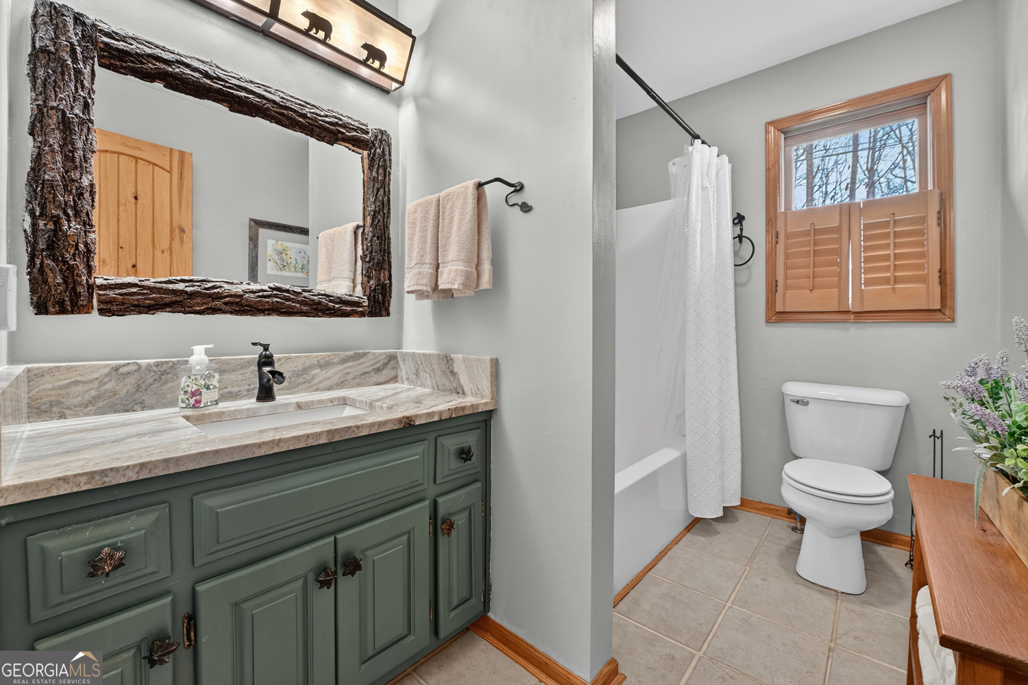1189 Walnut Ridge, Unit 4044 Ellijay, GA 30536 - Photo 20 of 52 a bathroom with a toilet sink a mirror and vanity