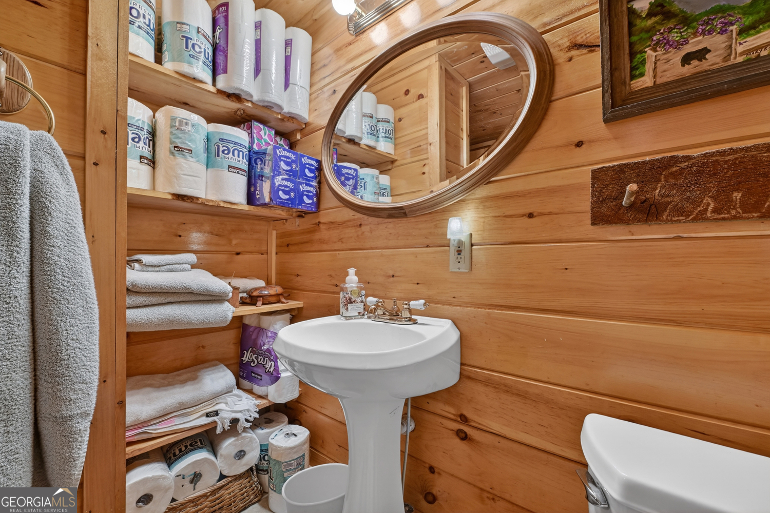 1189 Walnut Ridge, Unit 4044 Ellijay, GA 30536 - Photo 24 of 52 a bathroom with a toilet sink and mirror