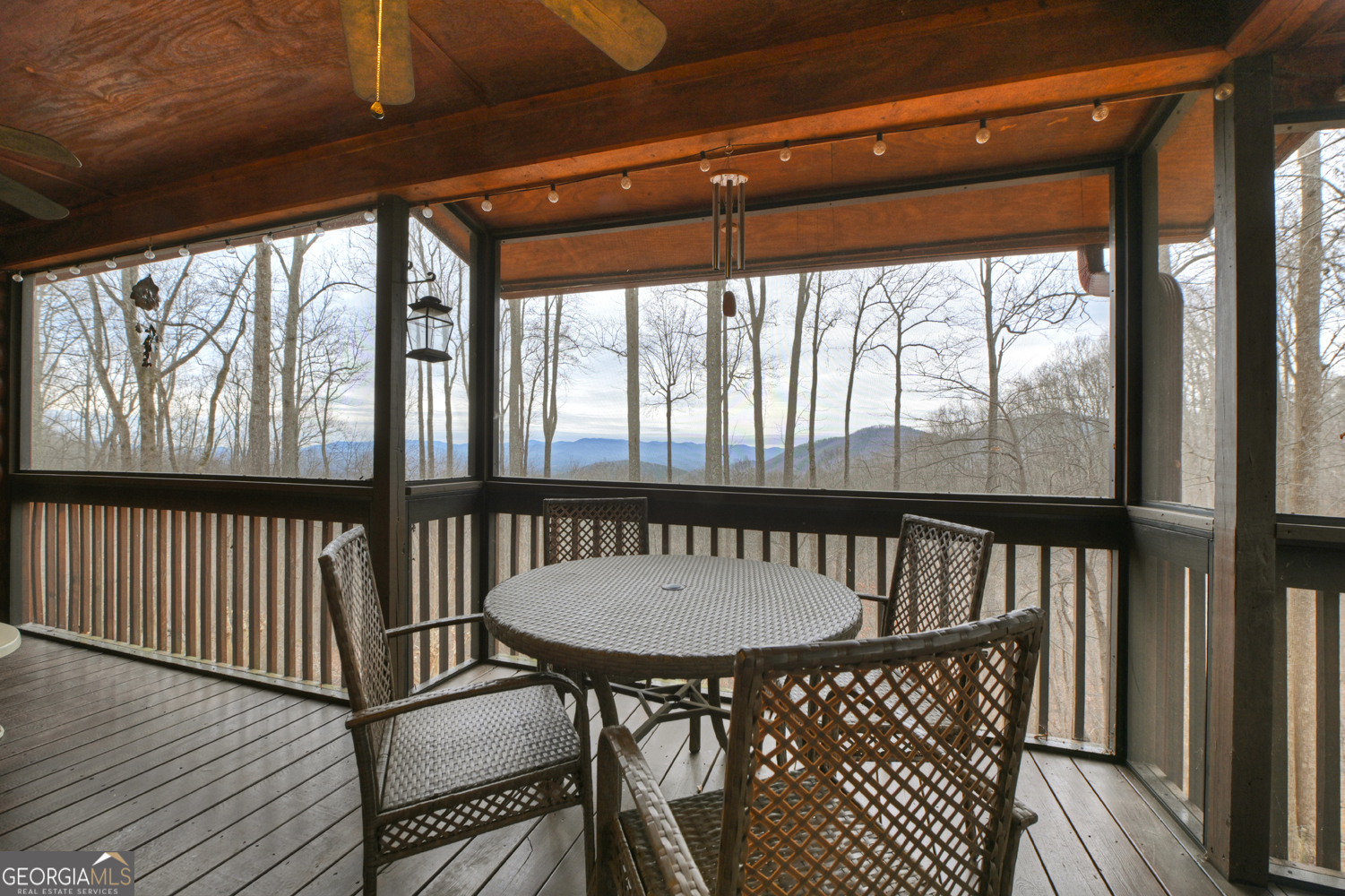 1189 Walnut Ridge, Unit 4044 Ellijay, GA 30536 - Photo 36 of 52 a view of a porch with furniture and wooden floor