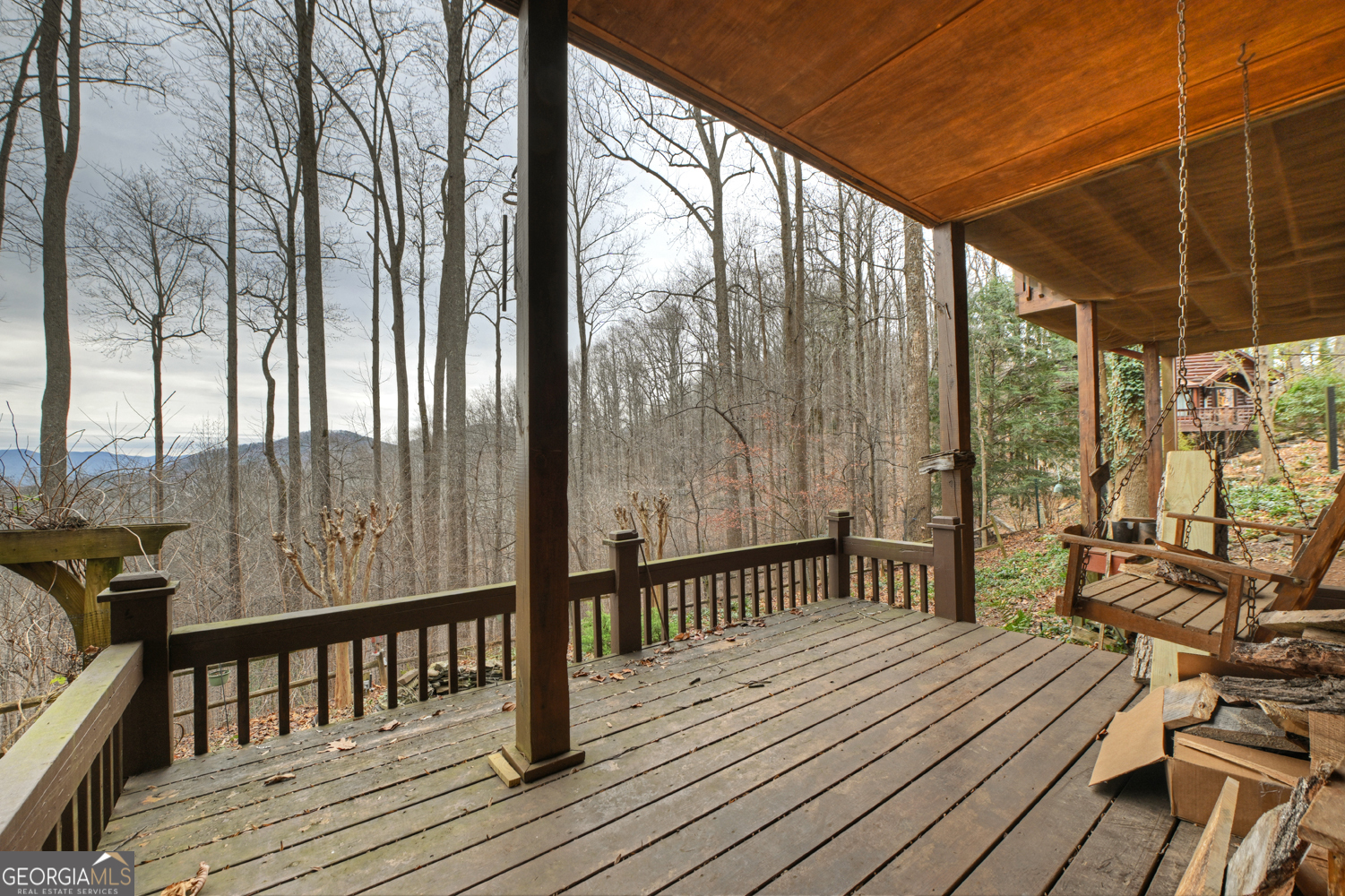 1189 Walnut Ridge, Unit 4044 Ellijay, GA 30536 - Photo 47 of 52 a view of balcony with couch and wooden floor