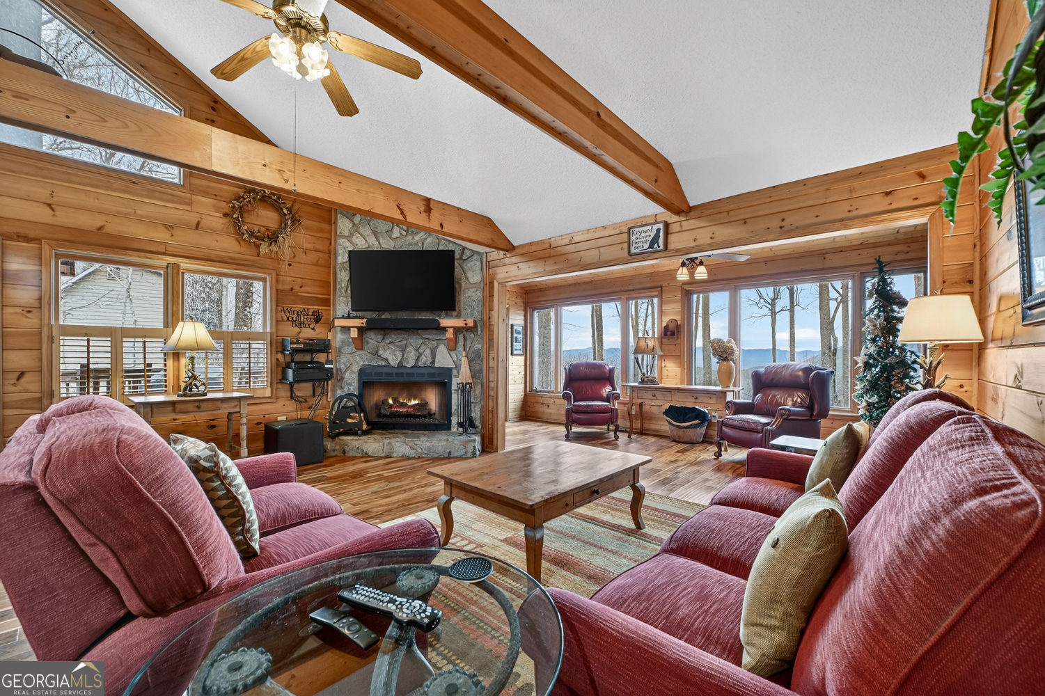 1189 Walnut Ridge, Unit 4044 Ellijay, GA 30536 - Photo 5 of 52 a living room with furniture a fireplace and a large window