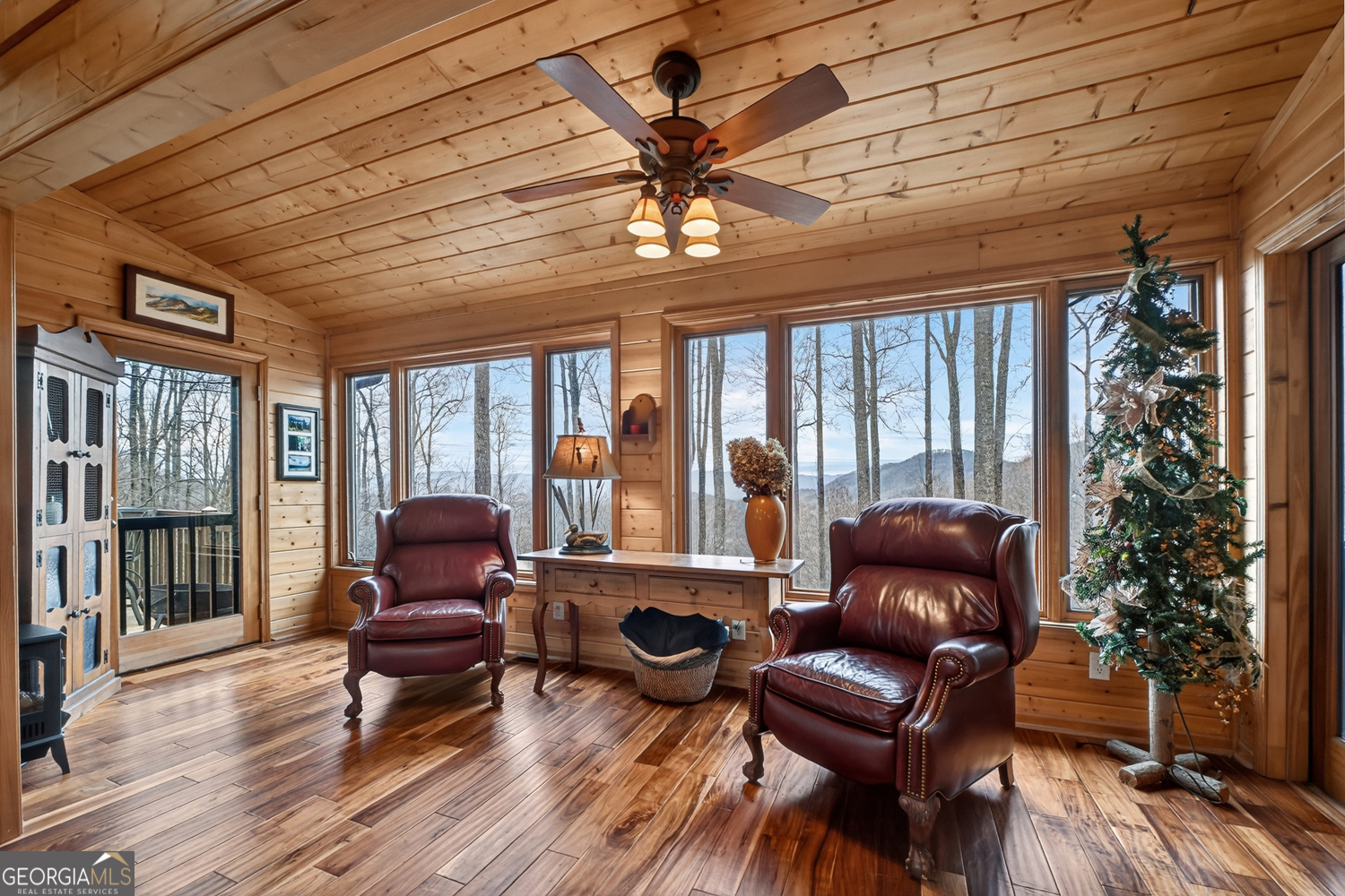 1189 Walnut Ridge, Unit 4044 Ellijay, GA 30536 - Photo 7 of 52 a living room with furniture ceiling fan and a rug
