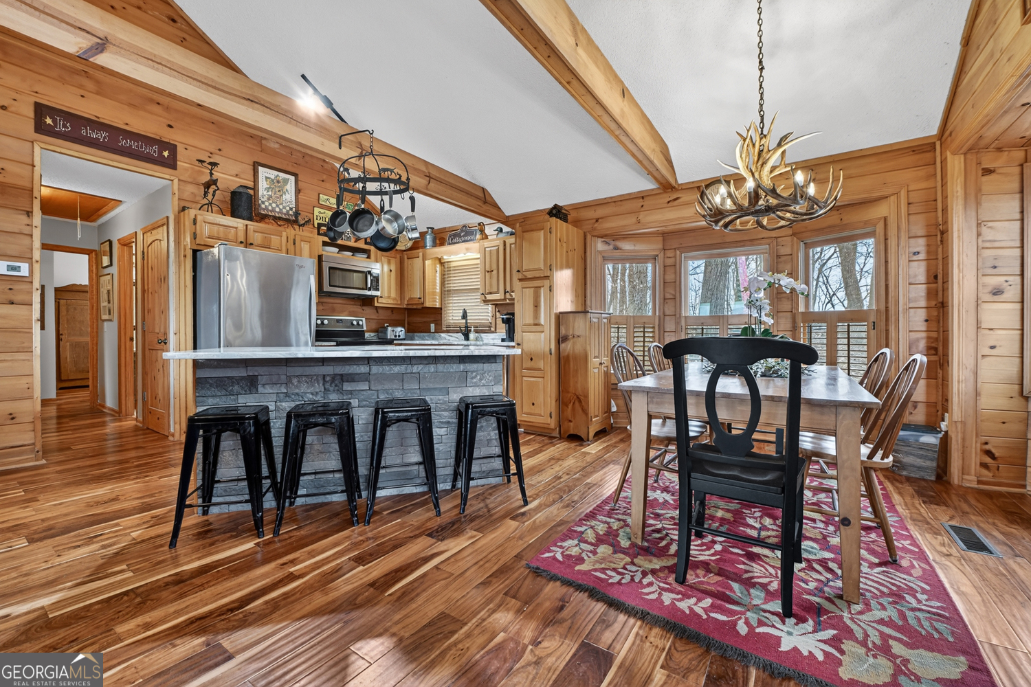 1189 Walnut Ridge, Unit 4044 Ellijay, GA 30536 - Photo 8 of 52 a view of a dining room with furniture and wooden floor