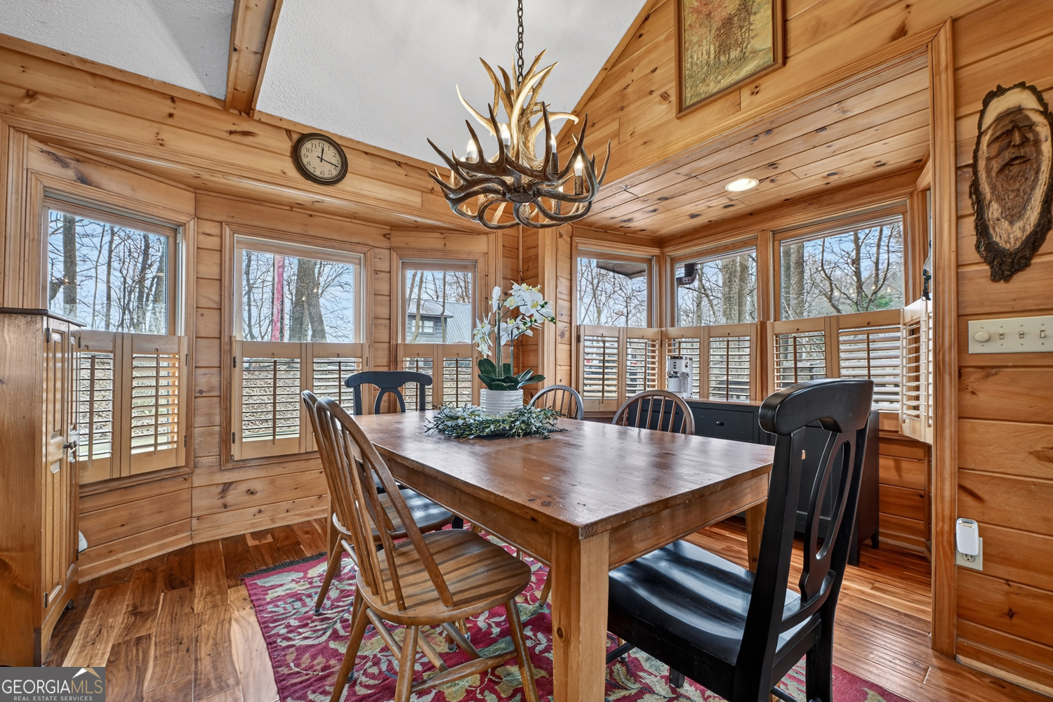 1189 Walnut Ridge, Unit 4044 Ellijay, GA 30536 - Photo 10 of 52 a view of a dining room with furniture a chandelier and wooden floor