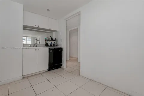 a kitchen with stainless steel appliances granite countertop a refrigerator and a stove