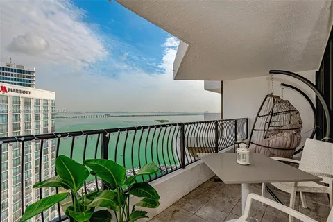 a view of balcony with furniture