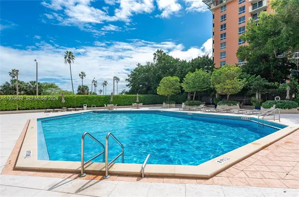 a view of a swimming pool with a lounge chairs