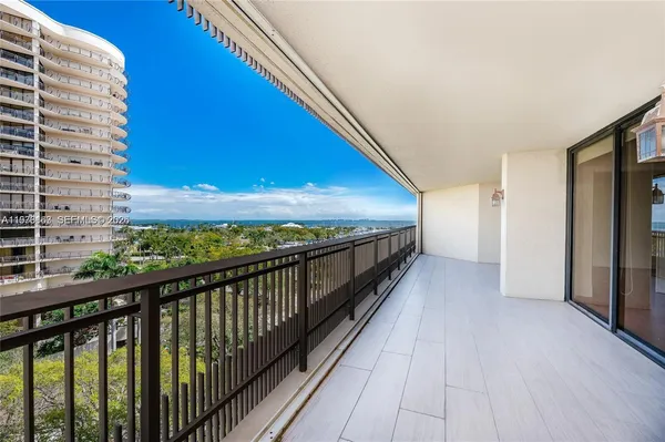 a view of balcony with wooden floor