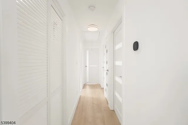 a view of a bathroom from a hallway