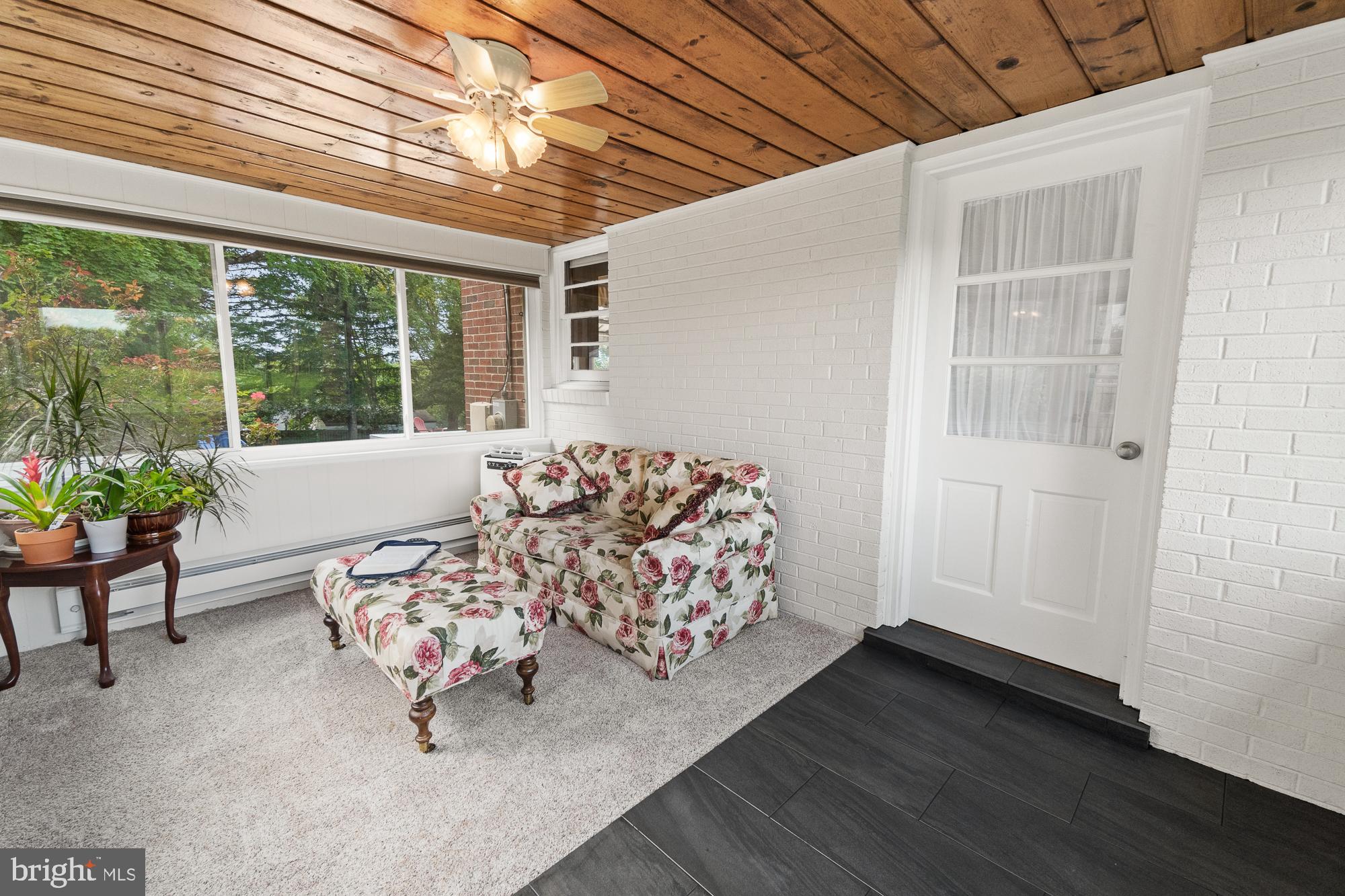 27912 Ridge Road Damascus, MD 20872 - Photo 16 of 40 Relax in the sunroom with new carpet and new tile