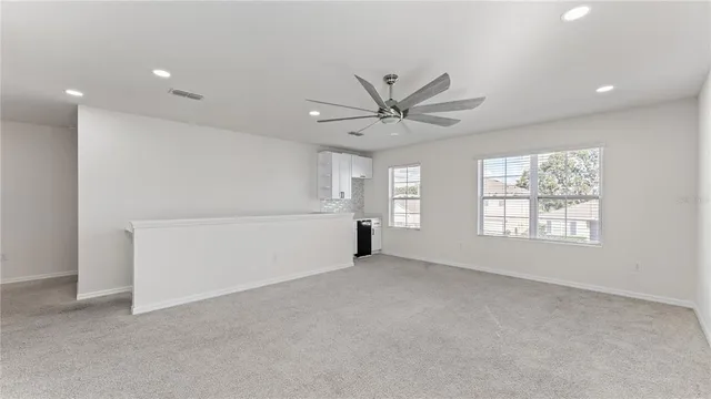 a view of an empty room with a window