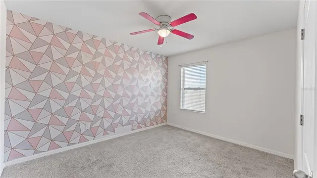 a very nice looking room with a ceiling fan