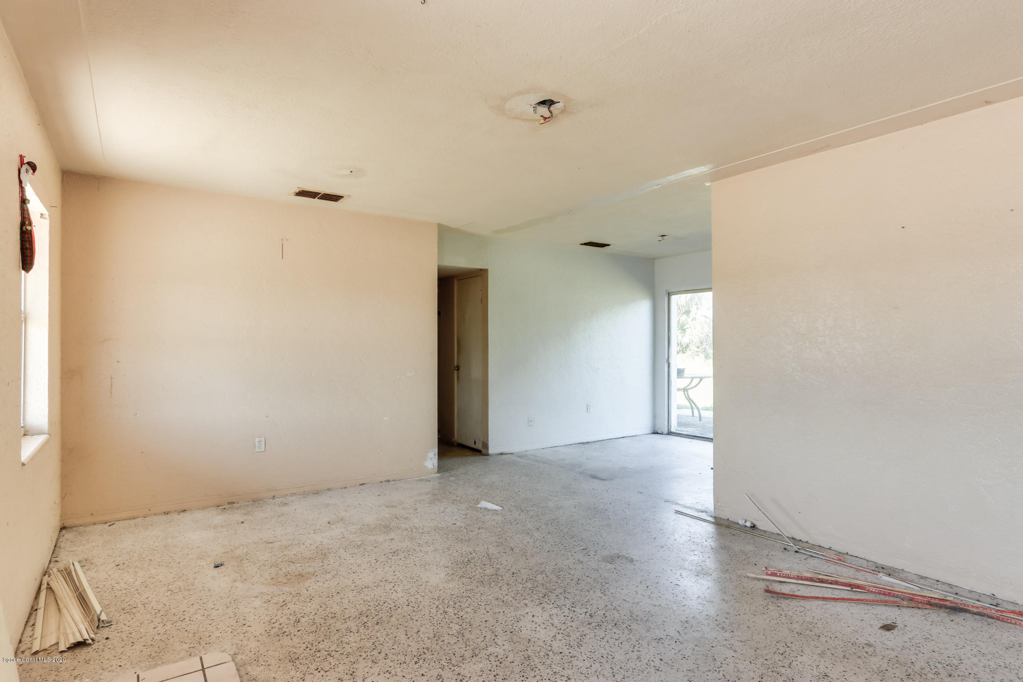 1880 Sarno Road Melbourne, FL 32935 - Photo 3 of 12 LR view to dining and hallway