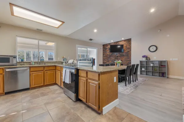 a kitchen with lots of counter top space and appliances
