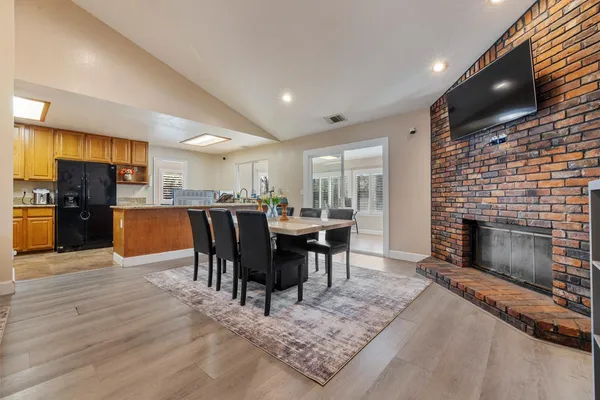 a view of a dining room with furniture window and fire place