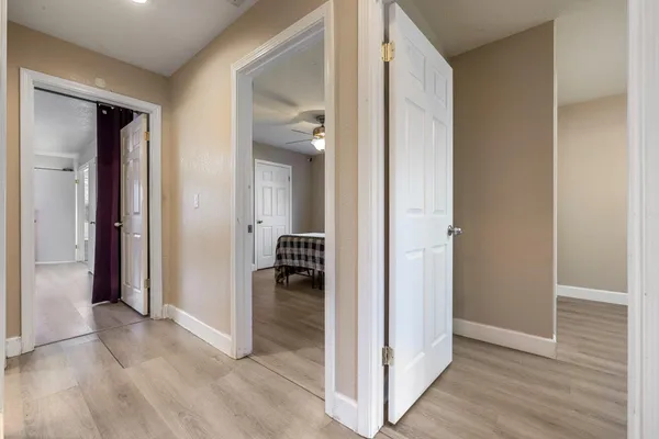 a view of a livingroom from a hallway