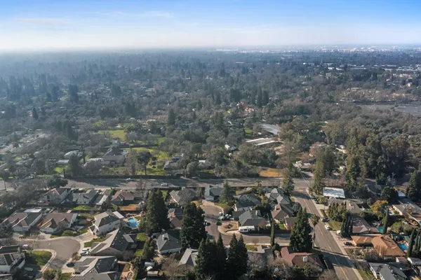 an aerial view of residential house and green space