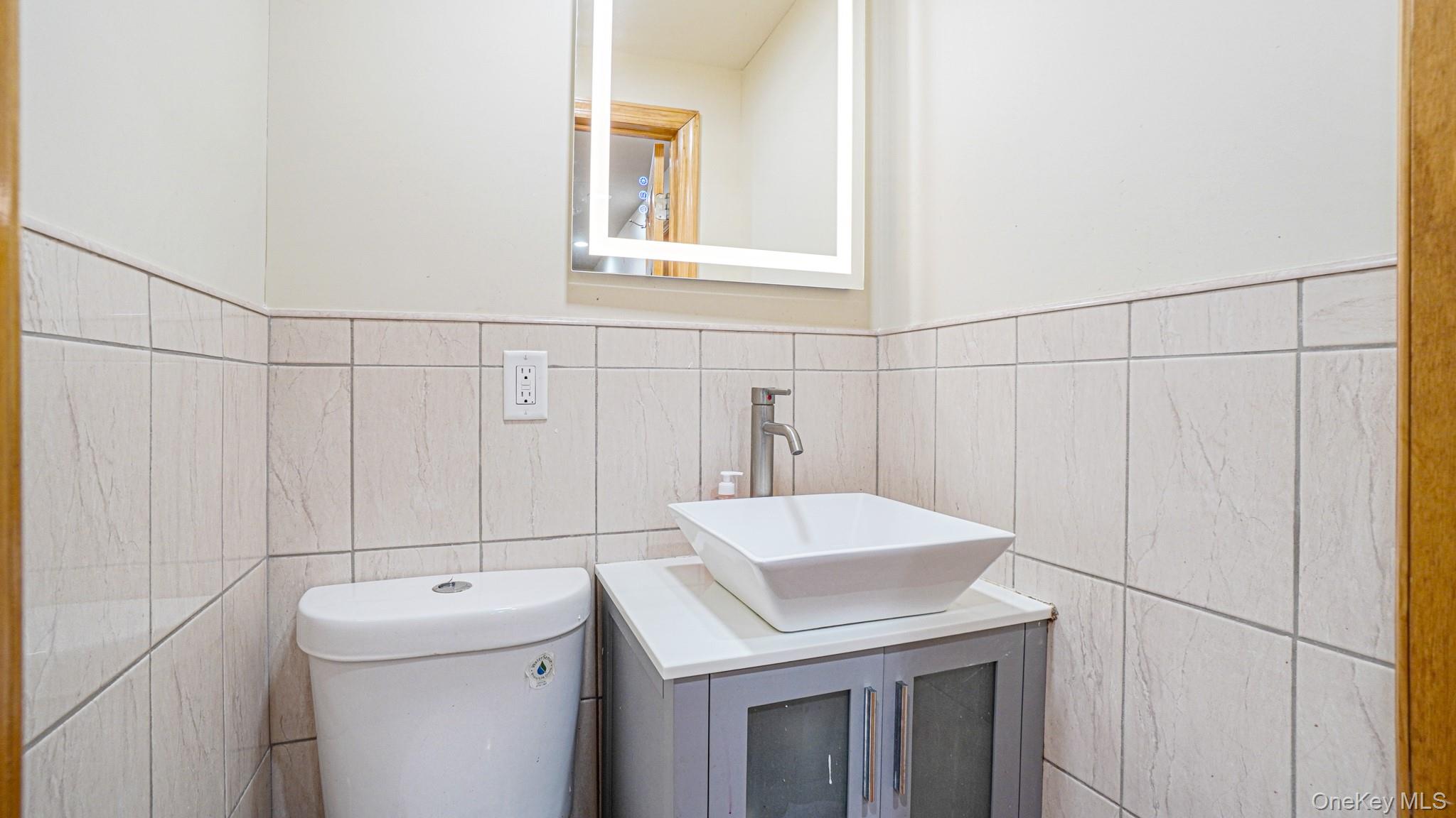 34 Diamond Street Elmont, NY 11003 - Photo 15 of 20 a utility room with dryer and washer