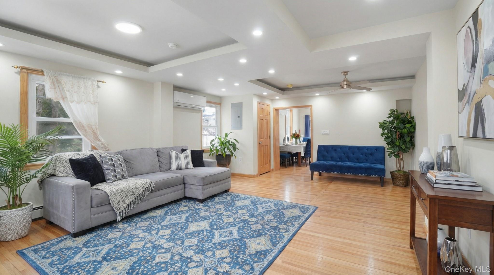 34 Diamond Street Elmont, NY 11003 - Photo 4 of 20 a living room with furniture and a wooden floor