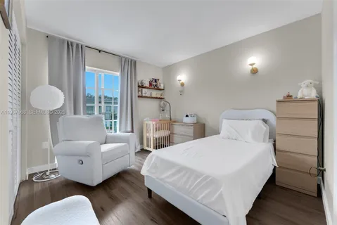 a spacious bathroom with a toilet sink and shower