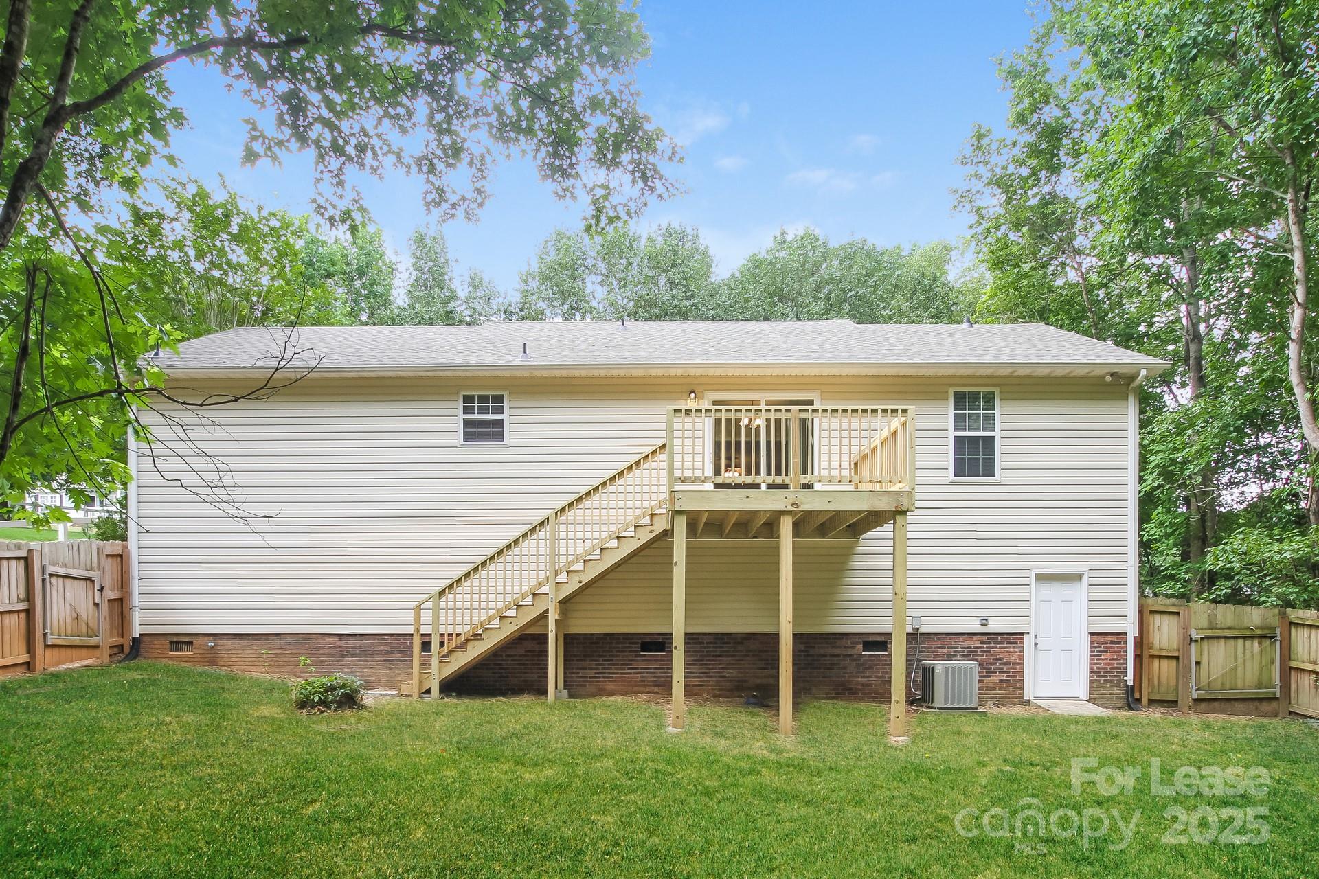 709 Firecrest Street Southeast Concord, NC 28025 - Photo 15 of 16 a view of a house with a yard