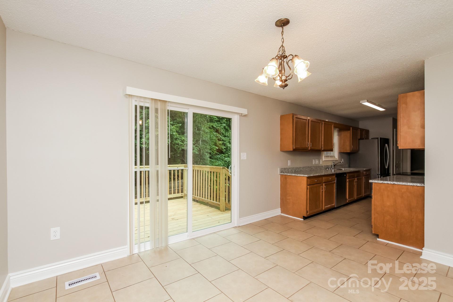 709 Firecrest Street Southeast Concord, NC 28025 - Photo 6 of 16 a view of a kitchen with a sink and microwave