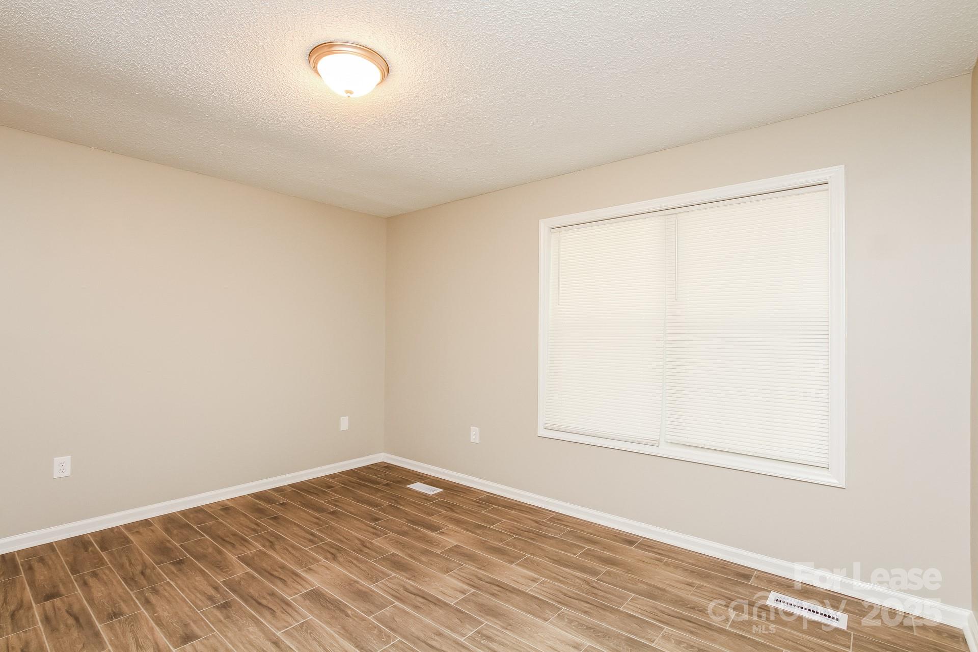 709 Firecrest Street Southeast Concord, NC 28025 - Photo 10 of 16 an empty room with a window